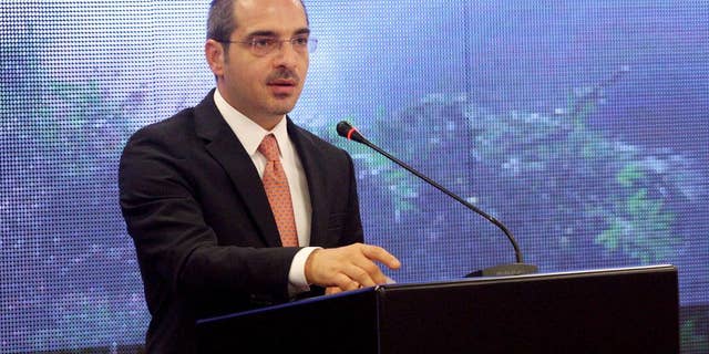 Albania’s Interior Minister Saimir Tahiri speaks at a conference in Tirana, Tuesday, Sept. 23, 2014 to show that police have destroyed marijuana of an estimated market value of 6.4 billion euro ($8.2 billion) this year - more than 60 percent of the country’s annual GDP. Since March police have destroyed 102 tons of marijuana, 530,000 cannabis plants and have arrested or indicted some 1,900 people. (AP Photo/Hektor Pustina)