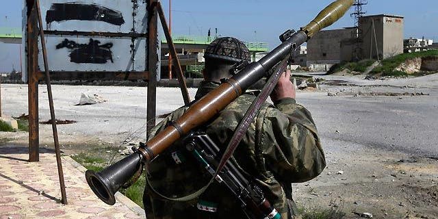 March 2, 2013: A Syrian fighter carries a shoulder-launched missile (AP/File)