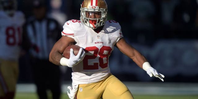 Dec 14, 2014; Seattle, WA, USA; San Francisco 49ers running back Carlos Hyde (28) carries the ball on a 289-yard run in the first quarter against the Seattle Seahawks at CenturyLink Field. Mandatory Credit: Kirby Lee-USA TODAY Sports