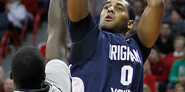 Jan. 5: BYU's Brandon Davies shoots over UNLV's Brice Massamba during an NCAA college basketball game in Las Vegas.