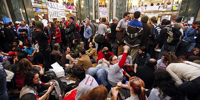 Feb. 27: Student Labor Action Coalition members demonstrate at the state Capitol in Madison, Wis., on the 13th day f protests over the governor's proposed budget.