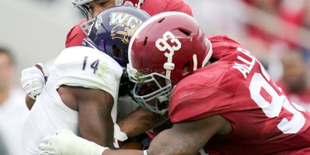 Nov 22, 2014; Tuscaloosa, AL, USA; Alabama Crimson Tide defensive lineman Jonathan Allen (93) and linebacker Trey DePriest (33) wrap up Western Carolina Catamounts wide receiver Karnorris Benson (14) at Bryant-Denny Stadium. Mandatory Credit: Marvin Gentry-USA TODAY Sports