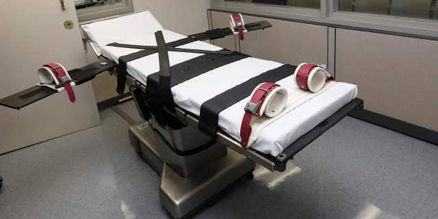 FILE - This Oct. 9, 2014, file photo shows the gurney in the the execution chamber at the Oklahoma State Penitentiary in McAlester, Okla.
