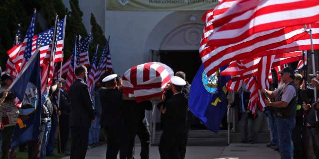 Nov. 1, 2016: The funeral begins for Coronado-based Chief Petty Officer Jason C. Finan, 34, of Anaheim, as his casket is carried into church in Coronado, Calif.