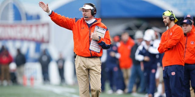 BIRMINGHAM, AL - DECEMBER 30: Head coach Gus Malzahn of the Auburn Tigers looks on against the Memphis Tigers during the Birmingham Bowl at Legion Field on December 30, 2015 in Birmingham, Alabama. Auburn defeated Memphis 31-10. (Photo by Joe Robbins/Getty Images)
