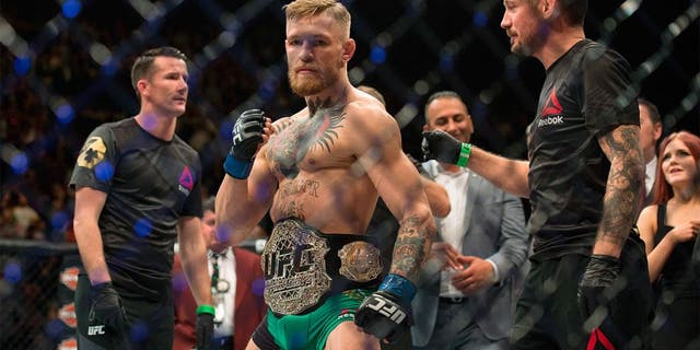 LAS VEGAS, NV - DECEMBER 12: UFC featherweight champion Conor McGregor celebrates his 13 second knockout victory over Jose Aldo in their featherweight championship fight during the UFC 194 event inside MGM Grand Garden Arena on December 12, 2015 in Las Vegas, Nevada. (Photo by Brandon Magnus/Zuffa LLC/Zuffa LLC via Getty Images)