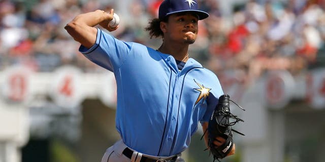 Tampa Bay Rays starting pitcher Chris Archer throws to the Boston Red Sox in the first inning of a spring training baseball game in Fort Myers, Fla., Friday, March 4, 2016. (AP Photo/Patrick Semansky)