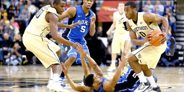 WINSTON-SALEM, NC - MARCH 05: Codi Miller-McIntyre #0 of the Wake Forest Demon Deacons steals the ball from Quinn Cook #2 of the Duke Blue Devils during their game against the Duke Blue Devils at Joel Coliseum on March 5, 2014 in Winston-Salem, North Carolina. (Photo by Streeter Lecka/Getty Images)