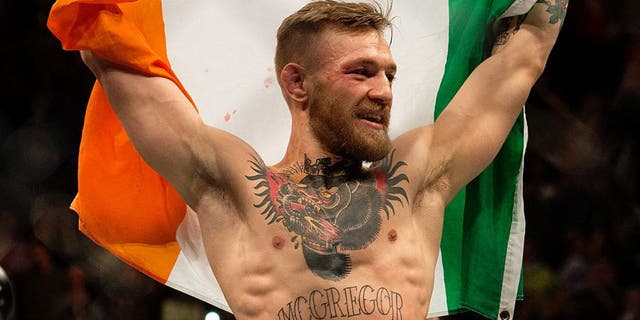 LAS VEGAS, NV - DECEMBER 12: UFC featherweight champion Conor McGregor celebrates his 13 second knockout victory over Jose Aldo in their featherweight championship fight during the UFC 194 event inside MGM Grand Garden Arena on December 12, 2015 in Las Vegas, Nevada. (Photo by Brandon Magnus/Zuffa LLC/Zuffa LLC via Getty Images)