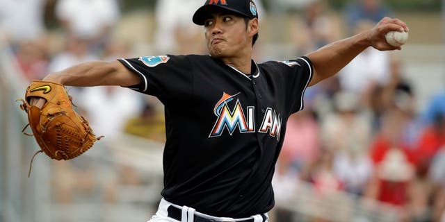 Miami Marlins starting pitcher Wei-Yin Chen throws during the first inning of an exhibition spring training baseball game against the St. Louis Cardinals Saturday, March 5, 2016, in Jupiter, Fla. (AP Photo/Jeff Roberson)