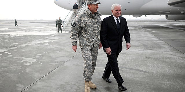 March 7: Defense Secretary Robert M. Gates, right, walks with Gen. David Petreaus upon his arrival in Kabul, Afghanistan.