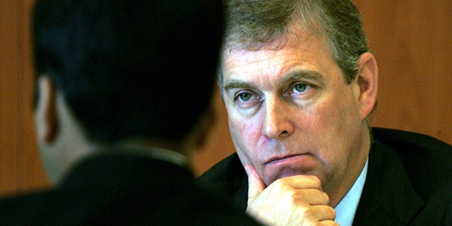 In this Monday, Oct. 30, 2006 file photo Prince Andrew, The Duke of York and U.K. Special Representative for International Trade and Investment, gestures during a luncheon session in his honor, organized by Indian Chambers of Commerce and Industries in New Delhi, India.