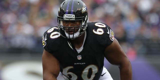 Oct 13, 2013; Baltimore, MD, USA; Baltimore Ravens tackle Eugene Monroe (60) in action against the Green Bay Packers at M&T Bank Stadium. Mandatory Credit: Mitch Stringer-USA TODAY Sports