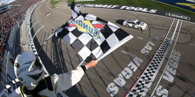LAS VEGAS, NV - MARCH 06: Brad Keselowski, driver of the #2 Miller Lite Ford, crosses the finish line to win the NASCAR Sprint Cup Series Kobalt 400 at Las Vegas Motor Speedway on March 6, 2016 in Las Vegas, Nevada. (Photo by Sean Gardner/NASCAR via Getty Images)