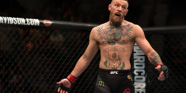 LAS VEGAS, NV - MARCH 5: Conor McGregor mocks Nate Diaz in their welterweight bout during the UFC 196 in the MGM Grand Garden Arena on March 5, 2016 in Las Vegas, Nevada. (Photo by Brandon Magnus/Zuffa LLC/Zuffa LLC via Getty Images)