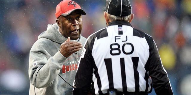 CHICAGO, IL - NOVEMBER 23: Head coach Lovie Smith of the Tampa Bay Buccaneers (L) talks with field judge Greg Gautreaux during the fourth quarter against the Chicago Bears on November 23, 2014 at Soldier Field in Chicago, Illinois. The Bears defeated the Buccaneers 21-13. (Photo by Brian Kersey/Getty Images)