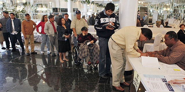 March 8: oters stand in line to cast their ballots in the special election in Bell, Calif.