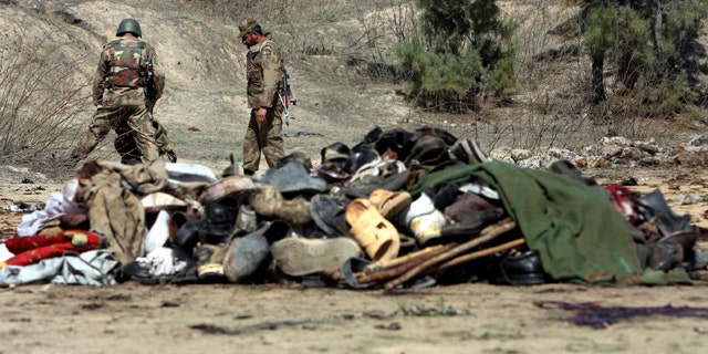 March 9: Pakistani army soldiers look for evidence at the site of bomb blast in Matani near Peshawar, Pakistan.