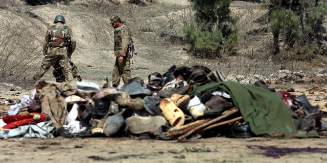 March 9: Pakistani army soldiers look for evidence at the site of bomb blast in Matani near Peshawar, Pakistan.