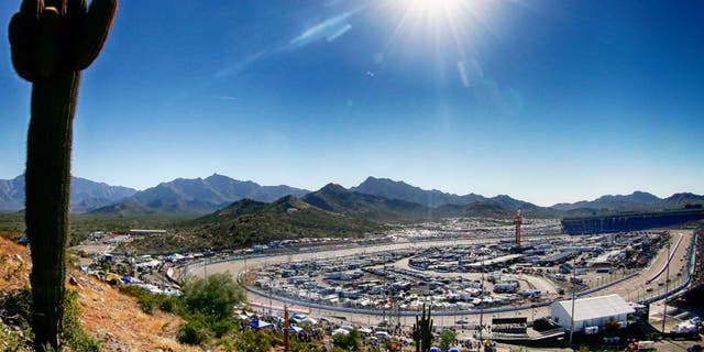 AVONDALE, AZ - NOVEMBER 09: (EDITOR'S NOTE: Image was processed using digital filters.) A general view of the speedway as cars race during the NASCAR Sprint Cup Series Quicken Loans Race for Heroes 500 at Phoenix International Raceway on November 9, 2014 in Avondale, Arizona. (Photo by Sean Gardner/NASCAR via Getty Images)