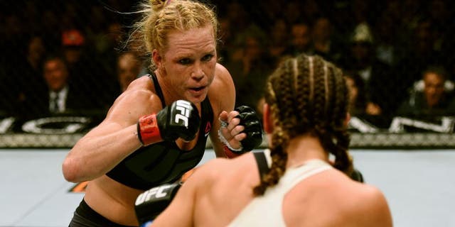 LAS VEGAS, NV - MARCH 05: (L-R) Holly Holm and Miesha Tate face off in their UFC women's bantamweight championship bout during the UFC 196 event inside MGM Grand Garden Arena on March 5, 2016 in Las Vegas, Nevada. (Photo by Josh Hedges/Zuffa LLC/Zuffa LLC via Getty Images)