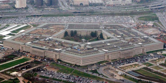FILE - The Pentagon is seen in this aerial view in Washington, in this March 27, 2008 file photo. The Pentagon has revised its Law of War guidelines to remove wording that could permit U.S. military commanders to treat war correspondents as “unprivileged belligerents” if they think the journalists are sympathizing or cooperating with enemy forces. The amended manual, published on July 22, 2016, also drops wording that equated journalism with spying. (AP Photo/Charles Dharapak, File)
