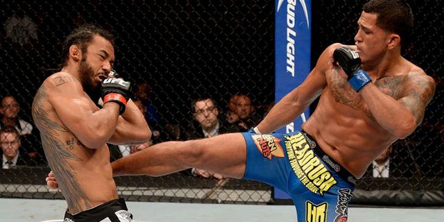 MILWAUKEE, WI - AUGUST 31: (R-L) Anthony 'Showtime' Pettis kicks Benson Henderson in their UFC lightweight championship bout at BMO Harris Bradley Center on August 31, 2013 in Milwaukee, Wisconsin. (Photo by Jeff Bottari/Zuffa LLC/Zuffa LLC via Getty Images)