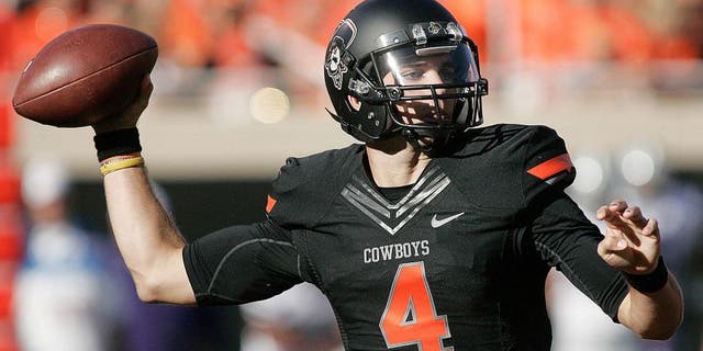 STILLWATER, OK - OCTOBER 5: Quarterback J.W. Walsh #4 of the Oklahoma State Cowboys looks to throw against the Kansas State Wildcats October 5, 2013 at Boone Pickens Stadium in Stillwater, Oklahoma. The Cowboys defeated the Wildcats 33-29. (Photo by Brett Deering/Getty Images)