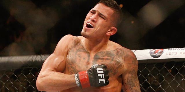 Anthony Pettis reacts to his victory over Gilbert Melendez in their UFC lightweight championship bout during the UFC 181 event inside the Mandalay Bay Events Center on December 6, 2014 in Las Vegas, Nevada. (Photo by Josh Hedges/Zuffa LLC/Zuffa LLC via Getty Images)