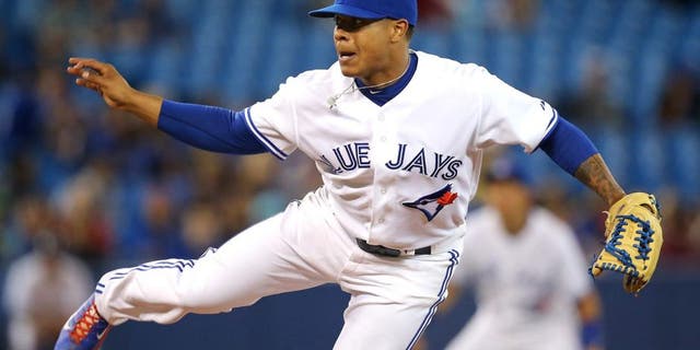 TORONTO, CANADA - SEPTEMBER 26: Marcus Stroman #54 of the Toronto Blue Jays delivers a pitch during MLB game action against the Baltimore Orioles on September 26, 2014 at Rogers Centre in Toronto, Ontario, Canada. (Photo by Tom Szczerbowski/Getty Images)