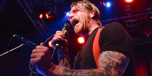 FILE - In this Feb. 13, 2016 file photo, singer Jesse Hughes of Eagles of Death Metal performs at Debaser Medis in Stockholm, Sweden.