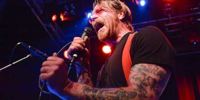 FILE - In this Feb. 13, 2016 file photo, singer Jesse Hughes of Eagles of Death Metal performs at Debaser Medis in Stockholm, Sweden.