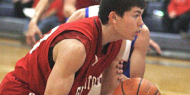 In this Feb. 1, 2011, photo, Roma High School's Robert Garza moves to the net in a game with with Veterans Memorial High School in Mission, Texas.