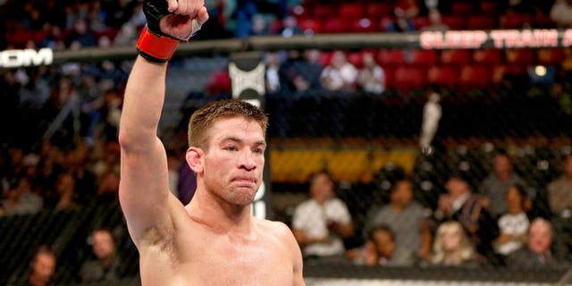 SACRAMENTO, CA - DECEMBER 14: Sam Stout reacts to his victory over Cody McKenzie in their lightweight bout during the UFC on FOX event at Sleep Train Arena on December 14, 2013 in Sacramento, California. (Photo by Josh Hedges/Zuffa LLC/Zuffa LLC via Getty Images)