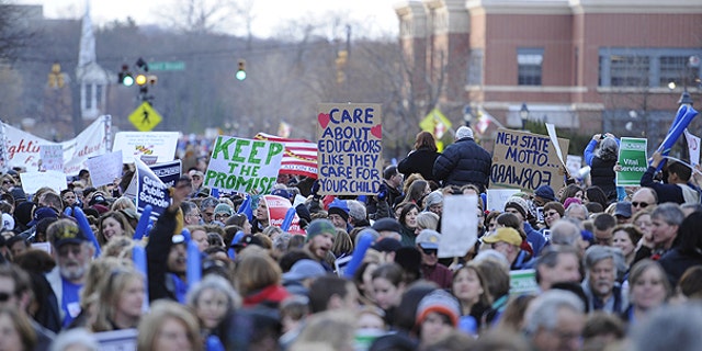 March 14: Protesters hold up signs at the Keep the Promise rally, a rally to protest pension reform in Annapolis, Md.