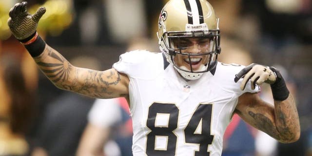Sep 21, 2014; New Orleans, LA, USA; New Orleans Saints wide receiver Kenny Stills (84) congratulates wide receiver Marques Colston (12) after a touchdown in the fourth quarter against the Minnesota Vikings at the Mercedes-Benz Superdome. New Orleans defeated the Vikings 20-9. Mandatory Credit: Crystal LoGiudice-USA TODAY Sports