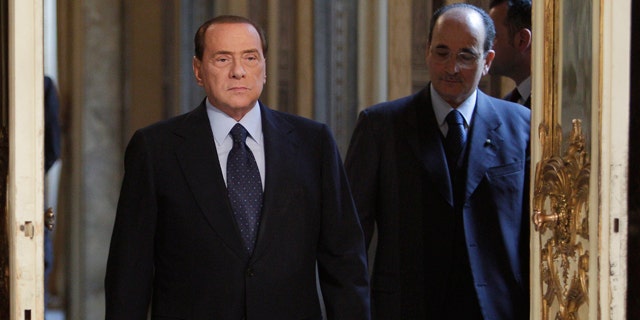 March 14: Italian premier Silvio Berlusconi arrives to meet European Commission president Jose Manuel Barroso, not in photo, at Palazzo Chigi in Rome. (AP)