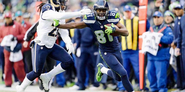 Dec 28, 2014; Seattle, WA, USA; Seattle Seahawks wide receiver Kevin Norwood (81) stiff arms St. Louis Rams cornerback Janoris Jenkins (21) during the second half at CenturyLink Field. Seattle defeated St. Louis 20-6. Mandatory Credit: Steven Bisig-USA TODAY Sports