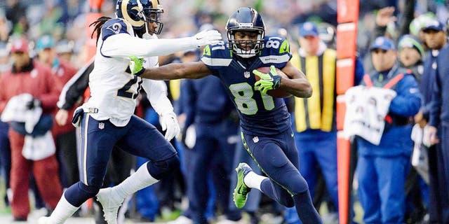Dec 28, 2014; Seattle, WA, USA; Seattle Seahawks wide receiver Kevin Norwood (81) stiff arms St. Louis Rams cornerback Janoris Jenkins (21) during the second half at CenturyLink Field. Seattle defeated St. Louis 20-6. Mandatory Credit: Steven Bisig-USA TODAY Sports