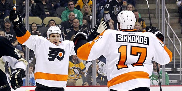 Mar 16, 2014; Pittsburgh, PA, USA; Philadelphia Flyers center Brayden Schenn (left) celebrates with right wing Wayne Simmonds (17) after Schenn scored a goal against the Pittsburgh Penguins during the first period at the CONSOL Energy Center. Mandatory Credit: Charles LeClaire-USA TODAY Sports