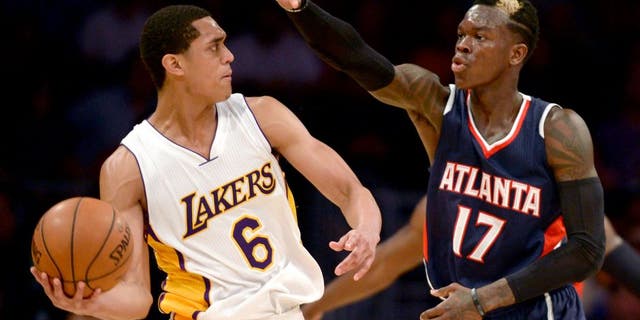 Mar 15, 2015; Los Angeles, CA, USA; Los Angeles Lakers guard Jordan Clarkson (6) looks to pass the ball defended by Atlanta Hawks guard Dennis Schroder (17) during the fourth quarter at Staples Center. The Atlanta Hawks won 91-86. Mandatory Credit: Kelvin Kuo-USA TODAY Sports