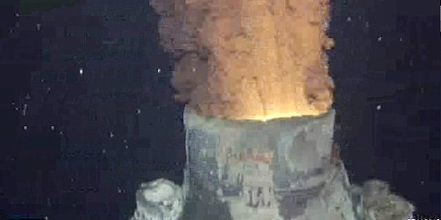 Oil and gas continues to leak from BP's Gulf of Mexico well after the oil containment cap was removed from so it could be replaced with a bigger cap, in the Gulf of Mexico, in this frame grab captured from a BP live video feed.