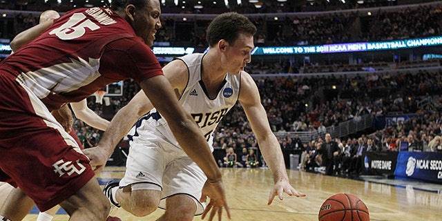 March 20: Notre Dame guard Ben Hansbrough and Florida State forward Terrance Shannon, left, chase a loose ball in the first half of a third-round NCAA Southwest Regional tournament college basketball game in Chicago.