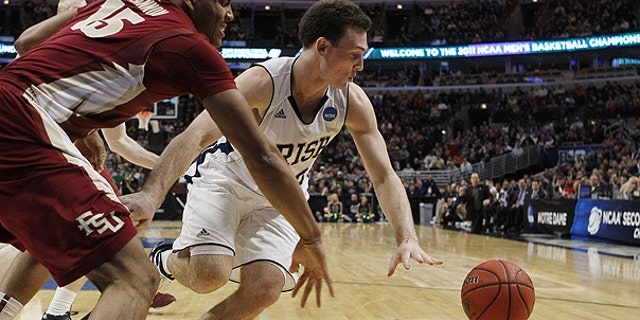 March 20: Notre Dame guard Ben Hansbrough and Florida State forward Terrance Shannon, left, chase a loose ball in the first half of a third-round NCAA Southwest Regional tournament college basketball game in Chicago.