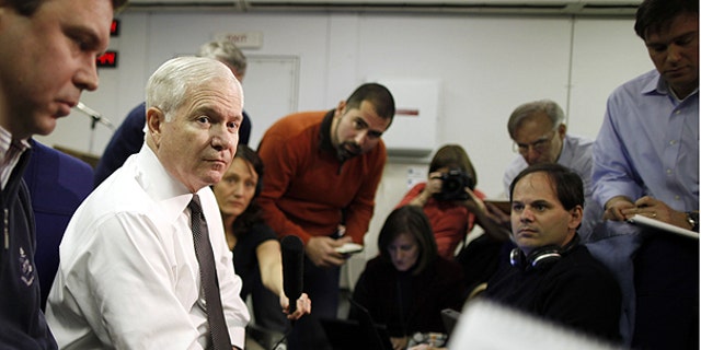 March 20: U.S. Defense Secretary Robert Gates speaks about Libya as he briefs reporters on board a military plane en route to St. Petersburg, Russia.
