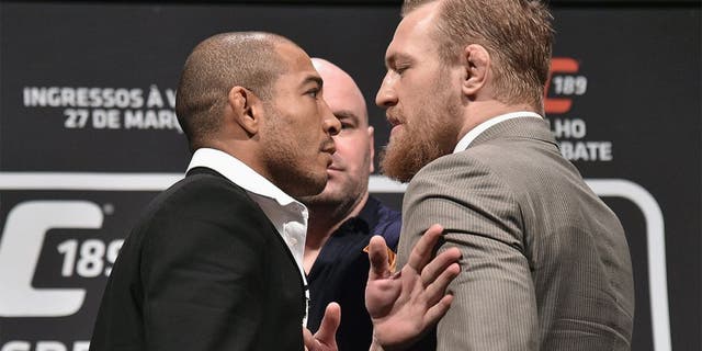 RIO DE JANEIRO, BRAZIL - MARCH 20: UFC Featherweight Champion Jose Aldo of Brazil (L) and challenger Conor McGregor face off as UFC President Dana White (C) stands in during the 189 World Media Tour Launch press conference at Maracanazinho on March 20, 2015 in Rio de Janeiro, Brazil. (Photo by Buda Mendes/Zuffa LLC/Zuffa LLC via Getty Images)
