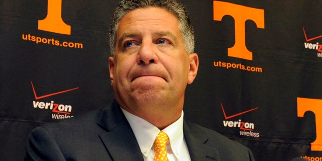 This Sept. 10, 2010, file photo shows University of Tennessee men's basketball coach Bruce Pearl grimacing during a news conference, where Pearl expressed remorse for giving misleading information to the NCAA during an investigation into the school's basketball program, in Knoxville, Tenn.