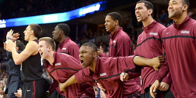 Mar 22, 2014; Spokane, WA, USA; Harvard Crimson players celebrate against the Michigan State Spartans in the second half of a men's college basketball game during the third round of the 2014 NCAA Tournament at Veterans Memorial Arena. Mandatory Credit: Kirby Lee-USA TODAY Sports