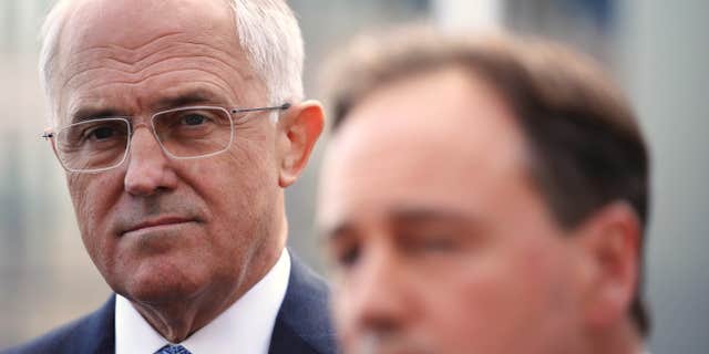 March 23, 2016: Australian Prime Minister Malcolm Turnbull, left, listens to Minister for the Environment Greg Hunt, as they attend a press conference in Sydney.