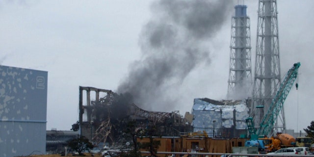 March 21: In this photo released by Tokyo Electric Power Co. (TEPCO), gray smoke rises from Unit 3 of the tsunami-stricken Fukushima Dai-ichi nuclear power plant in Okumamachi, Fukushima Prefecture, Japan.